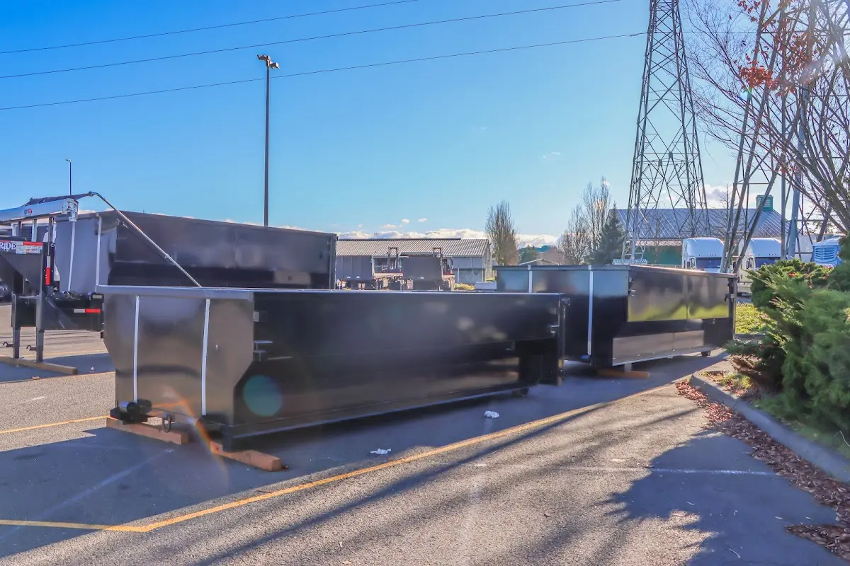 Roll-off dumpster ready for waste disposal at job site for Concrete Dumpster Rental in Highland City